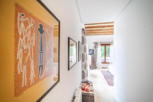 a hallway with paintings on the walls of a house at Stunning detached Villa in El Valle Golf Resort - ZO22EV in Murcia