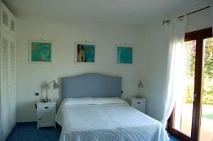 A bed or beds in a room at Villa Smeralda