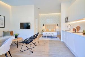 Televízia a/alebo spoločenská miestnosť v ubytovaní Lofts Parque de Huelin