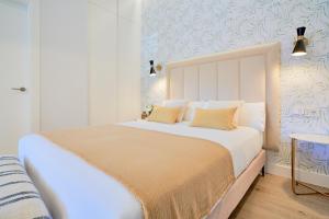 Posteľ alebo postele v izbe v ubytovaní Lofts Parque de Huelin
