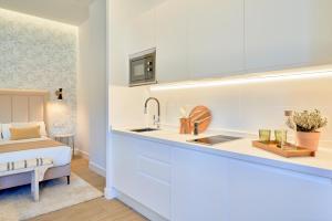 Posteľ alebo postele v izbe v ubytovaní Lofts Parque de Huelin