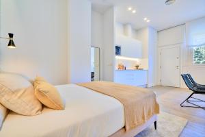 Posteľ alebo postele v izbe v ubytovaní Lofts Parque de Huelin