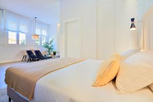 Posteľ alebo postele v izbe v ubytovaní Lofts Parque de Huelin