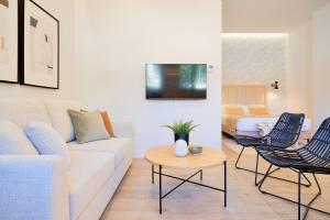 Televízia a/alebo spoločenská miestnosť v ubytovaní Lofts Parque de Huelin
