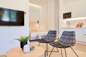 Televízia a/alebo spoločenská miestnosť v ubytovaní Lofts Parque de Huelin