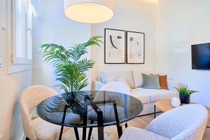 Televízia a/alebo spoločenská miestnosť v ubytovaní Lofts Parque de Huelin