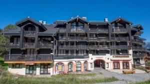 a large apartment building with balconies on it at Grand Morillon- C215 Appt vue piste-4 pers in Morillon