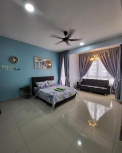 a bedroom with a bed and a ceiling fan at Bali Residence Impian Raudah in Melaka