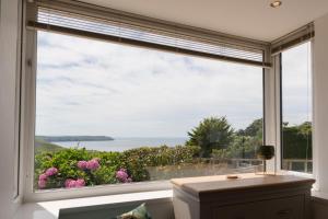 a large window with a view of the ocean at Lower Upover in Woolacombe