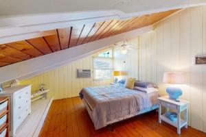 a bedroom with a bed and a wooden ceiling at Edgewater Acres --- 39167 Garfield Avenue in Selbyville