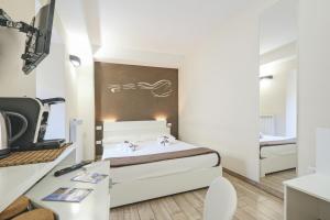 Postel nebo postele na pokoji v ubytování Le Suite del Dormiglione