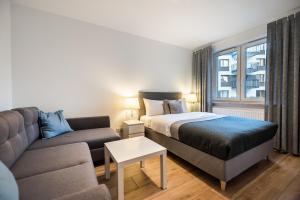 Posteľ alebo postele v izbe v ubytovaní Develia Mała Praga Charming Studio