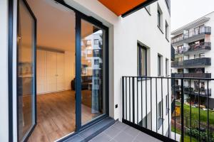 Balkón alebo terasa v ubytovaní Develia Mała Praga Charming Studio