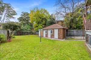 a yard with a small building in a yard at Burwood New 2 Bedroom 2 Bath Apt Free Parking in Sydney