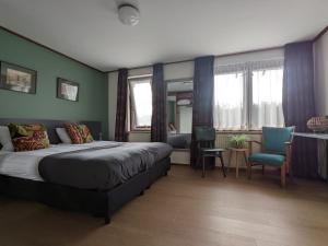 En eller flere senger på et rom på Hotel De Gravin van Vorden