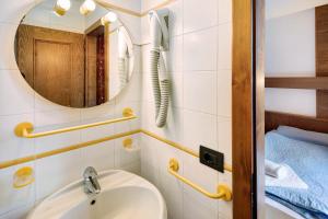 a bathroom with a sink and a mirror at Casa San Marco n 9 in Livigno