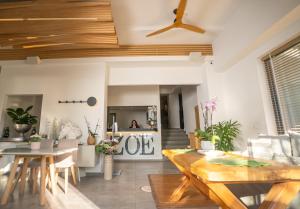 a living room with a wooden ceiling at Zoe Seaside Resort in Gialova