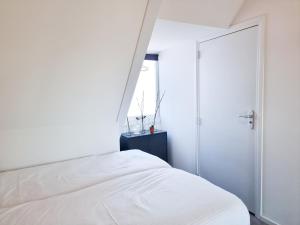 Postel nebo postele na pokoji v ubytování Studio Hello Domburg 4 DO42