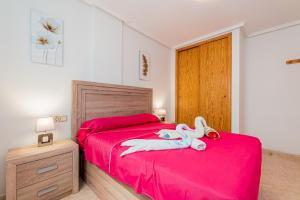 Postel nebo postele na pokoji v ubytování Apartamento Playa Capitan