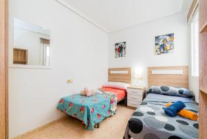 Postel nebo postele na pokoji v ubytování Apartamento Playa Capitan