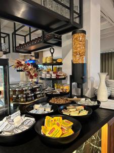 a buffet line with different types of food on at Hostellerie Klokhof in Kortrijk