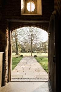 an entrance to a building with a stone walkway at St Giles House Accommodation in Wimborne Saint Giles