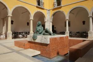 a statue in the middle of a building at Pousada Convento de Tavira in Tavira