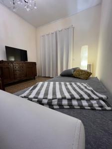 A bed or beds in a room at Palazzo Senesi