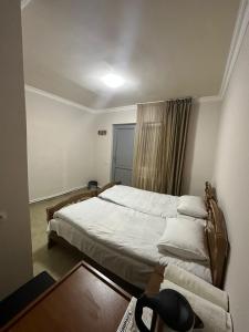 Postel nebo postele na pokoji v ubytování Hotel Amigo