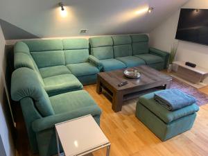 a living room with a couch and a table at Apartmány City 2 in Ostrava