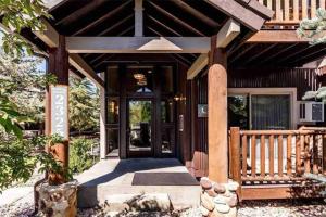 a front door of a home with a wooden roof at Mountain Getaway - Pool, Hot Tub, Balcony, WiFi in Park City