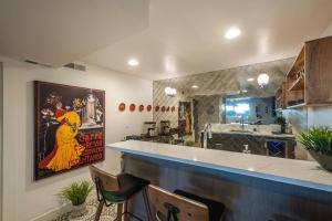 a restaurant with a bar with two chairs and a counter at Modern Apartment close to freeway! in Salt Lake City