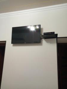a flat screen tv hanging on a wall at Guest House Safina-S&D in Samarkand +32 photos