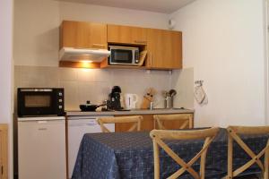 Kuchyň nebo kuchyňský kout v ubytování Appartement A108 + 7 fotografií