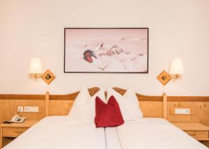 Letto o letti in una camera di Hotel Zauchensee Zentral