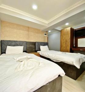 Postel nebo postele na pokoji v ubytování biglife hotel