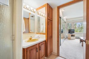 a bathroom with a sink and a mirror at Atrium 106 in Breckenridge +38 photos