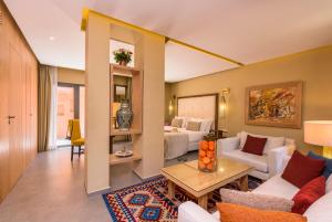 a living room with a couch and a table at Berbère Palace in Ouarzazate