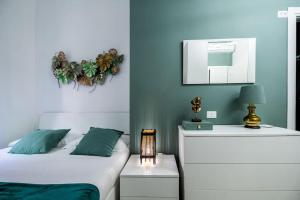 a bedroom with two beds and a mirror at [Linate Airport] Elegant Suite,Tram 1 minute away in Milan