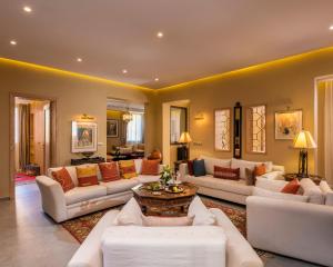 a large living room with couches and a table at Berbère Palace in Ouarzazate