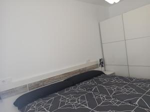 Łóżko lub łóżka w pokoju w obiekcie Casa cerca de la playa con patio y garaje privado