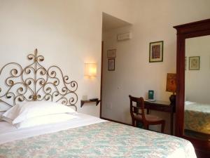 A bed or beds in a room at Classic Hotel