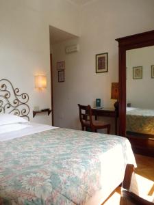 A bed or beds in a room at Classic Hotel