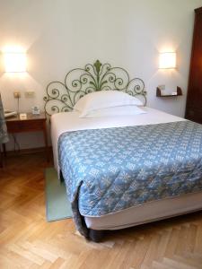 A bed or beds in a room at Classic Hotel