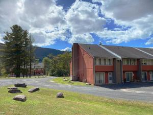 a large red building with rocks in front of it at 1 Mile to Hunter Mt! Cozy 3 Bedroom in Hunter