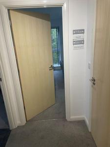 a door leading into a room with a hallway at Lovely 1 Bedroom Condo in Leicester City in Leicester
