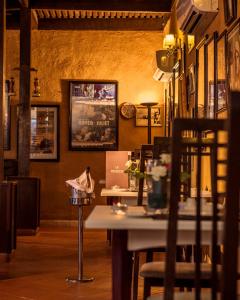 a restaurant with a table and chairs in a room at Berbère Palace in Ouarzazate