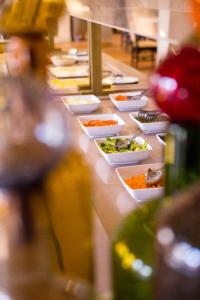 a buffet line with many bowls of food at Berbère Palace in Ouarzazate