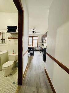 a bathroom with a toilet and a sink in a room at The Karlov. Gorgeous ,spacious 2BD/ 1BA w/ Parking in Chicago