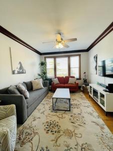 a living room with a couch and a table at The Karlov. Gorgeous ,spacious 2BD/ 1BA w/ Parking in Chicago